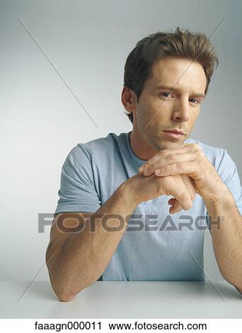 Man with hands together, portrait View Large Photo Image Stock Image - Man with hands together, portrait. Fotosearch