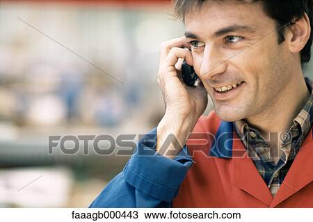 Manual worker using cell phone View Large Photo Image Stock Image - Manual worker using cell phone. Fotosearch