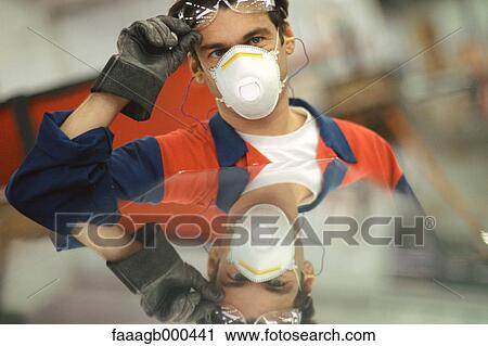 Manual worker wearing protective gear View Large Photo Image Stock Image - Manual worker wearing protective gear. Fotosearch