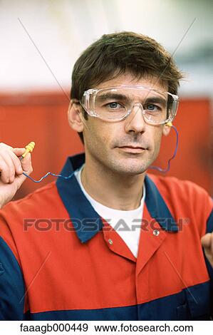 Manual worker wearing safety goggles View Large Photo Image Stock Photo - Manual worker wearing safety goggles. Fotosearch