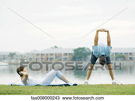 Mature couple exercising, lakeside View Large Photo Image Stock Image - Mature couple exercising, lakeside. Fotosearch