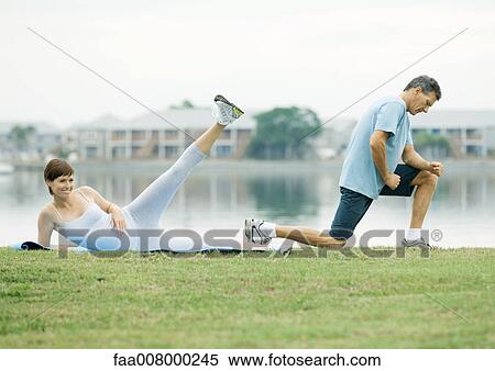 Mature couple exercising, lakeside View Large Photo Image Stock Photography - Mature couple exercising, lakeside. Fotosearch