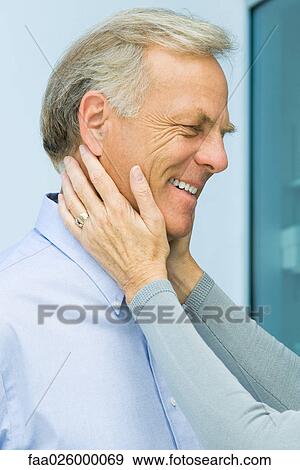Mature man with wife's hands on his face, cropped view View Large Photo Image Stock Photo - Mature man with wife's hands on his face, cropped view. Fotosearch