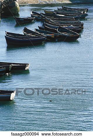 Picture - Morocco, Essaouira, canoes in harbour. Fotosearch