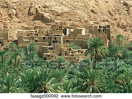 Morocco, palm grove and mountain-side village View Large Photo Image Stock Image - Morocco, palm grove and mountain-side village. Fotosearch