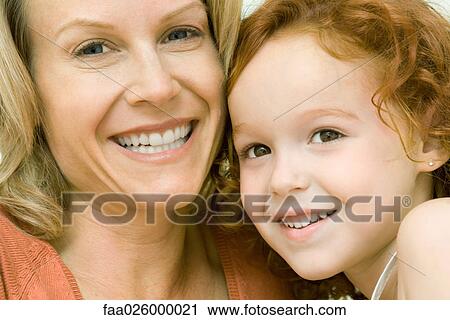 Mother and daughter cheek to cheek, smiling at camera, portrait View Large Photo Image Stock Image - Mother and daughter cheek to cheek, smiling at camera, portrait. Fotosearch
