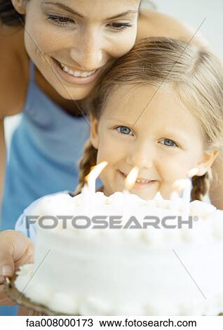 Mother and daughter with birthday cake View Large Photo Image Stock Image - Mother and daughter with birthday cake. Fotosearch