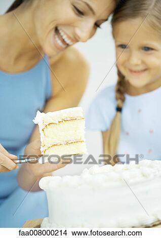 Mother and daughter with cake View Large Photo Image Picture - Mother and daughter with cake. Fotosearch