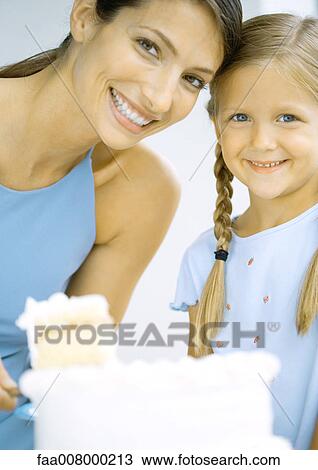Mother and daughter with cake View Large Photo Image Stock Image - Mother and daughter with cake. Fotosearch