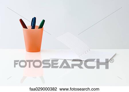 Notebook and pens inside cup View Large Photo Image Stock Image - Notebook and pens inside cup. Fotosearch