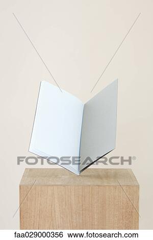 Open book on pedestal, blank pages inside View Large Photo Image Stock Photograph - Open book on pedestal, blank pages inside. Fotosearch