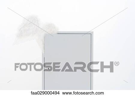 Pair of wings emerging from locked cabinet View Large Photo Image Picture - Pair of wings emerging from locked cabinet. Fotosearch