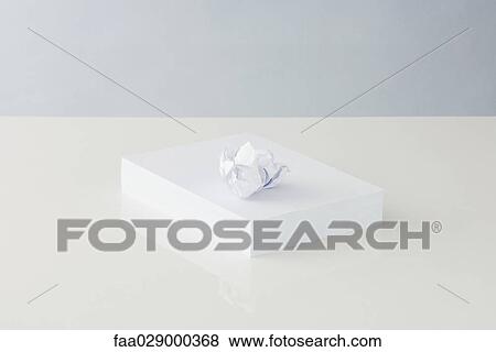 Paper ball on top of stacked office paper View Large Photo Image Stock Photo - Paper ball on top of stacked office paper. Fotosearch