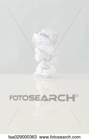 Stock Image - Paper balls stacked one on top of the other, close-up. Fotosearch