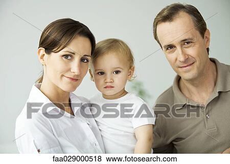Parents with toddler, portrait View Large Photo Image Stock Photo - Parents with toddler, portrait. Fotosearch