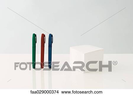 Pens and note block, close-up View Large Photo Image Picture - Pens and note block, close-up. Fotosearch