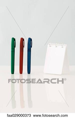 Pens and spiral notebook, close-up View Large Photo Image Stock Image - Pens and spiral notebook, close-up. Fotosearch