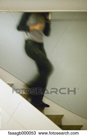 Person walking down stairs View Large Photo Image Stock Image - Person walking down stairs. Fotosearch