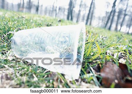 Plastic cup on grass View Large Photo Image Stock Image - Plastic cup on grass. Fotosearch