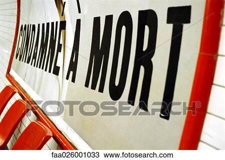 Poster with text in French reading "sentenced to death, " selective focus View Large Photo Image Stock Image - Poster with text in French reading "sentenced to death, " selective focus. Fotosearch