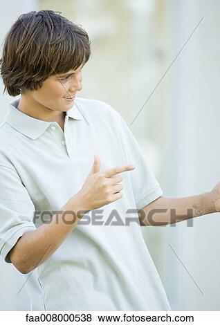 Preteen boy making gesture View Large Photo Image Stock Photo - Preteen boy making gesture. Fotosearch