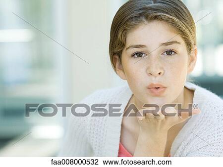 Preteen girl blowing kiss View Large Photo Image Stock Image - Preteen girl blowing kiss. Fotosearch