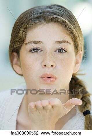 Preteen girl blowing kiss View Large Photo Image Stock Image - Preteen girl blowing kiss. Fotosearch