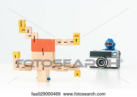 Robot taking photo of second robot breakdancing View Large Photo Image Stock Photo - Robot taking photo of second robot breakdancing. Fotosearch