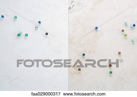 Scattered marbles, high angle view View Large Photo Image Stock Photo - Scattered marbles, high angle view. Fotosearch