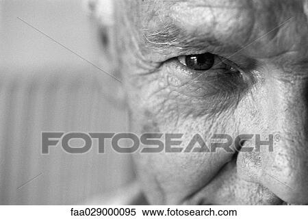 Stock Photography - Senior man looking at camera, close-up, cropped. Fotosearch