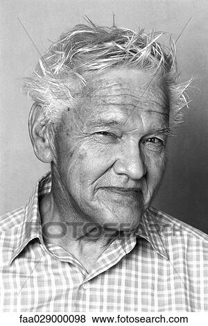 Stock Photo - Senior man smiling at camera, portrait. Fotosearch