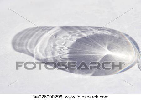 Shadow from water bottle, close-up View Large Photo Image Stock Photography - Shadow from water bottle, close-up. Fotosearch