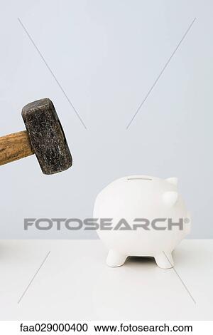 Sledgehammer posed over piggybank View Large Photo Image Stock Image - Sledgehammer posed over piggybank. Fotosearch