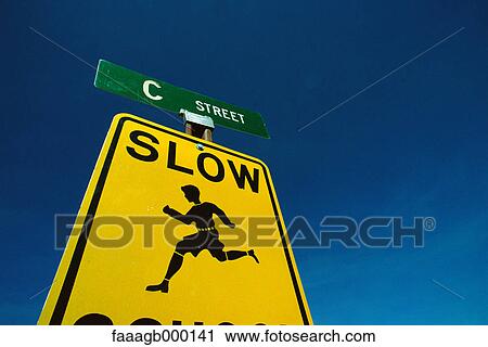 Slow children playing road sign View Large Photo Image Stock Image - Slow children playing road sign. Fotosearch
