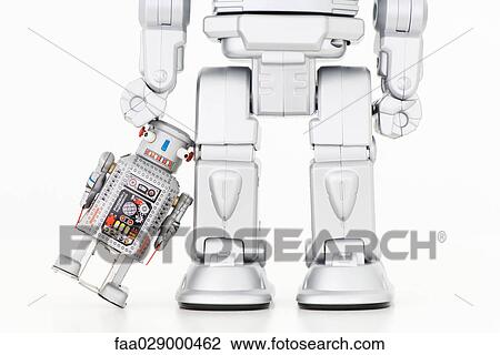 Small robot leaning against taller robot View Large Photo Image Stock Image - Small robot leaning against taller robot. Fotosearch