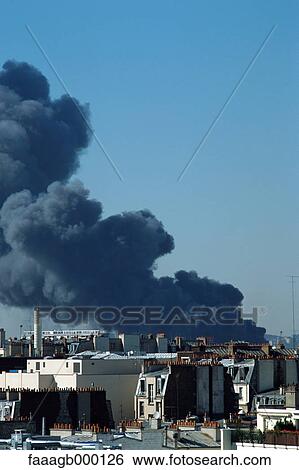 Smoke over rooftops View Large Photo Image Stock Photograph - Smoke over rooftops. Fotosearch