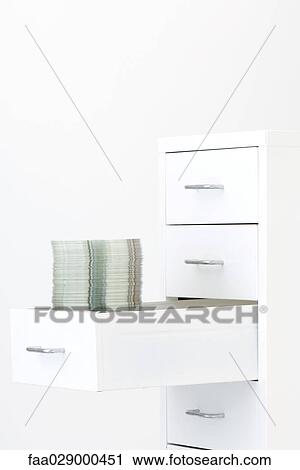 Stack of CDs in filing cabinet drawer View Large Photo Image Stock Image - Stack of CDs in filing cabinet drawer. Fotosearch