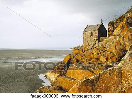 Stone house on rocks overlooking beach View Large Photo Image Stock Image - Stone house on rocks overlooking beach. Fotosearch