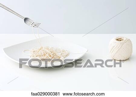 String on plate resembling spaghetti View Large Photo Image Stock Image - String on plate resembling spaghetti. Fotosearch