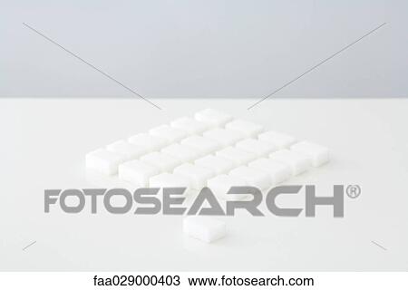 Sugar cubes arranged on table View Large Photo Image Stock Image - Sugar cubes arranged on table. Fotosearch
