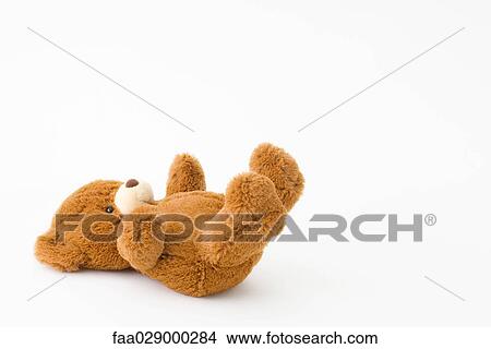 Teddy bear lying on back View Large Photo Image Picture - Teddy bear lying on back. Fotosearch