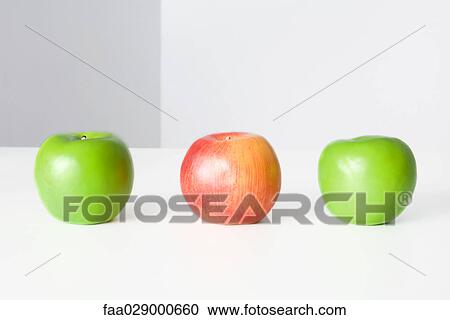 Three apples in a row, two green and one red, close-up View Large Photo Image Stock Image - Three apples in a row, two green and one red, close-up. Fotosearch