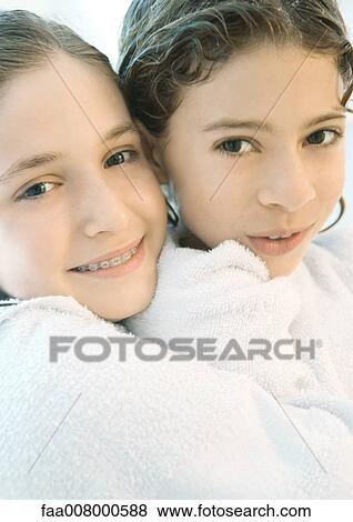 Two girls wrapped in towels View Large Photo Image Stock Photo - Two girls wrapped in towels. Fotosearch