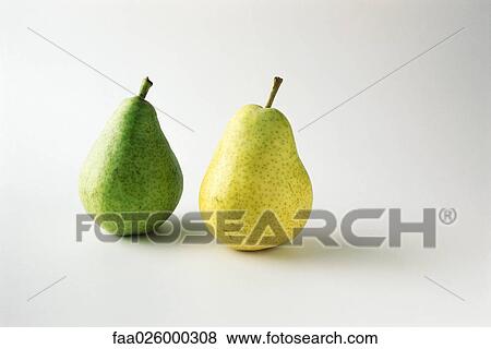 Two ripening pears side by side, close-up View Large Photo Image Stock Photo - Two ripening pears side by side, close-up. Fotosearch