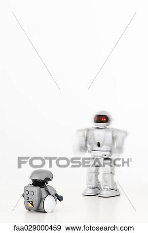 Two robots approaching each other View Large Photo Image Stock Photo - Two robots approaching each other. Fotosearch