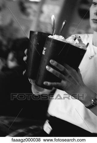 Waitress carrying milkshakes View Large Photo Image Stock Photo - Waitress carrying milkshakes. Fotosearch