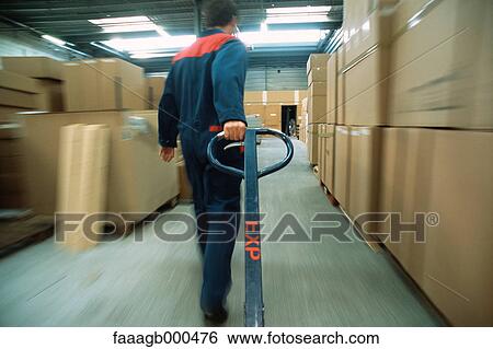 Warehouse worker View Large Photo Image Stock Photograph - Warehouse worker. Fotosearch