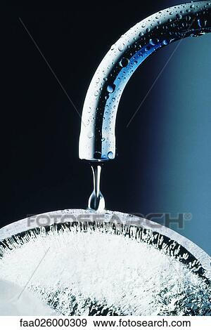 Water faucet dripping on ice, close-up View Large Photo Image Stock Photo - Water faucet dripping on ice, close-up. Fotosearch
