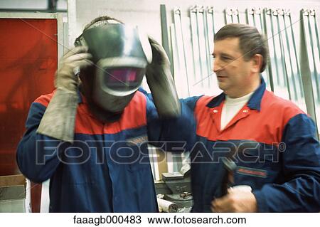 Welder and apprentice View Large Photo Image Stock Image - Welder and apprentice. Fotosearch