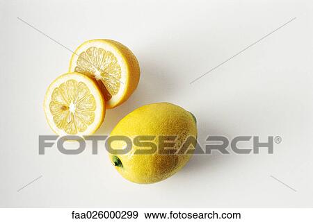 Whole and sliced lemons, close-up View Large Photo Image Stock Photo - Whole and sliced lemons, close-up. Fotosearch